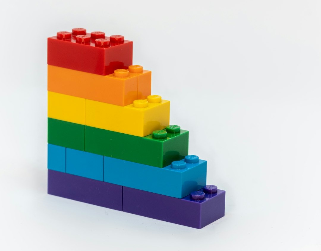 Coloured Lego bricks stacked as a staircase, each layer a separate piece that can be pulled out and reused